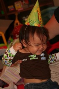 Later that night we had Noby try on his birthday hat.  He didnt really like them! haha