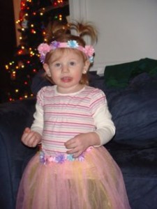 Avery showing off the tutu and crown we got her.  Love the tongue sticking out!!