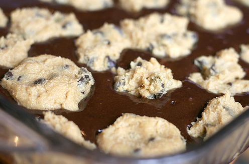 Make brownie mix and cookie mix according to the package.  Lightly press spoonful of cookie dough into the brownie mix. (picture taken from Bakerella's website.)